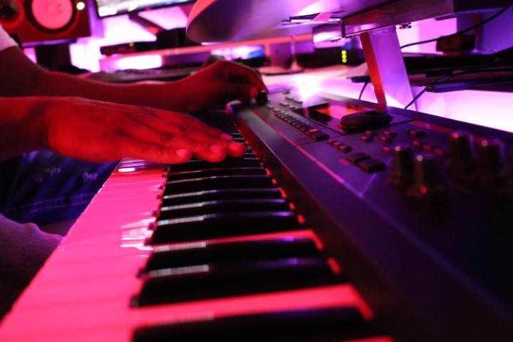 Producer playing piano for RnB beat